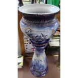 A blue floral pottery jardiniere on stand