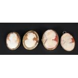 Four cameo brooches,