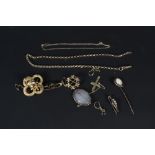 A quantity of yellow metal jewellery including brooches, stick pin,