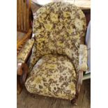 A Victorian floral upholstered button back armchair on brass castors