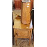 An oak octagonal plant stand and an oak pot cupboard