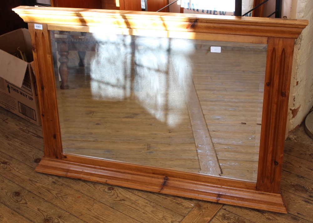 A modern pine overmantel mirror