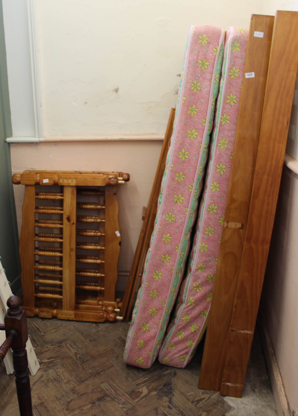 A pine bunk bed with mattresses