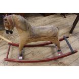 A child's vintage small rocking horse