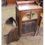 An Edwardian mahogany music cabinet with mirrored and glazed door and a small low oak chair