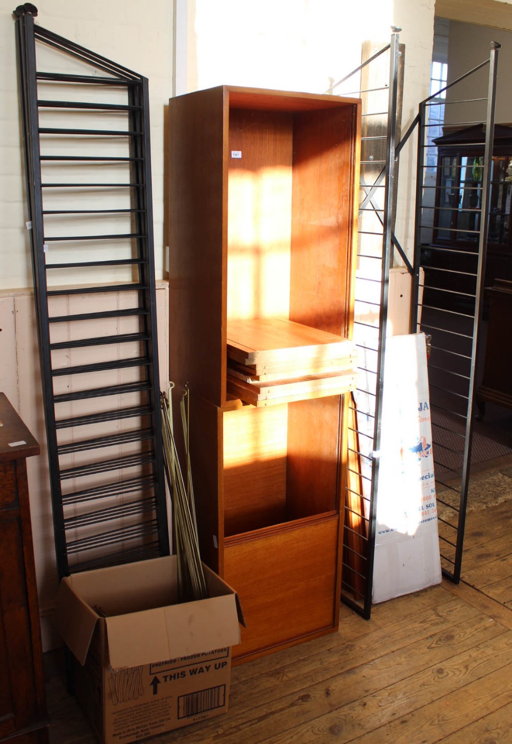 A Ladderax style shelving system with cupboards