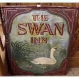 An original metal hanging double sided hand painted pub sign "The Swan Inn"
