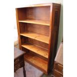 A pine and mahogany open bookcase with inset side panel