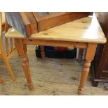 A square pine kitchen table