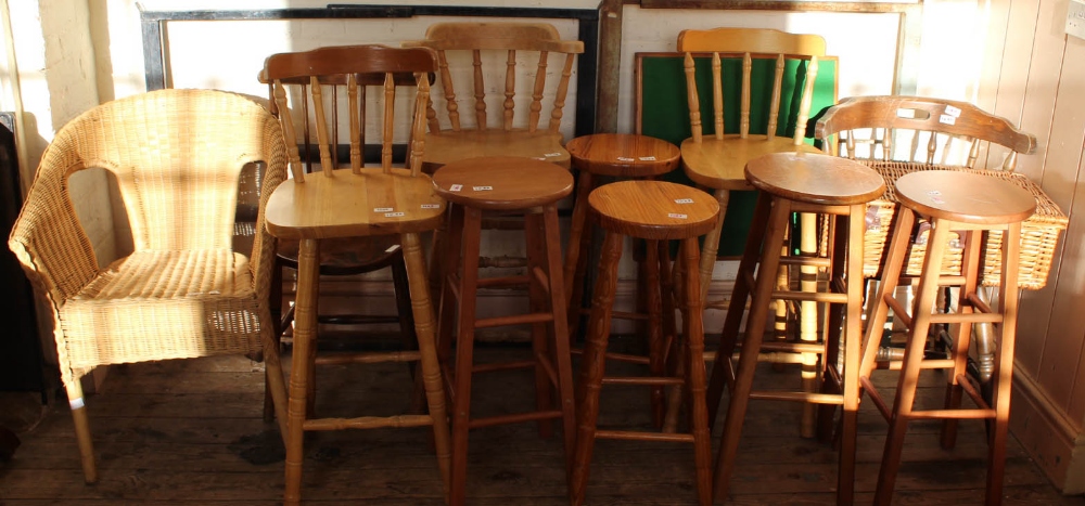 Five various pine bar stools and three bar chairs, a wicker picnic hamper with contents,