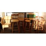 Five various pine bar stools and three bar chairs, a wicker picnic hamper with contents,