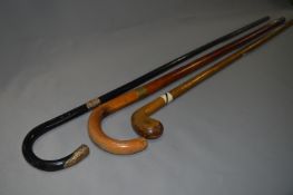 Three Walking Canes (One with Gold Plated Band)