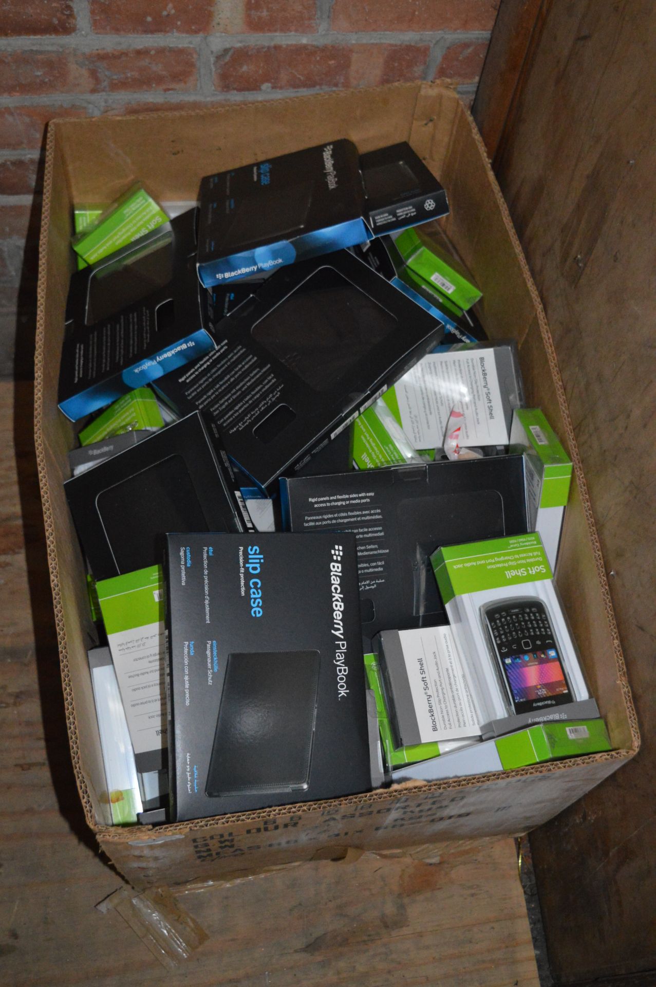 *Box Containing Blackberry Softshell Cases for Pla