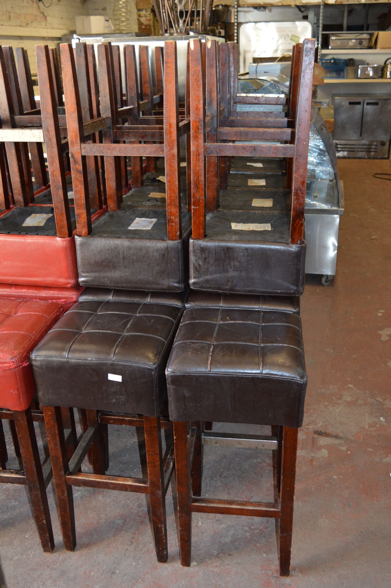 *Eighteen Hardwood Barstools with Brown Faux Leathe