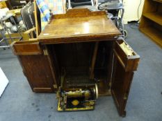 Jones Sewing Machine in Oak Cabinet