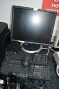 Dell Monitor, Two Keyboards and a Mouse