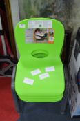 *Four Children's Green Plastic Stackable Chairs