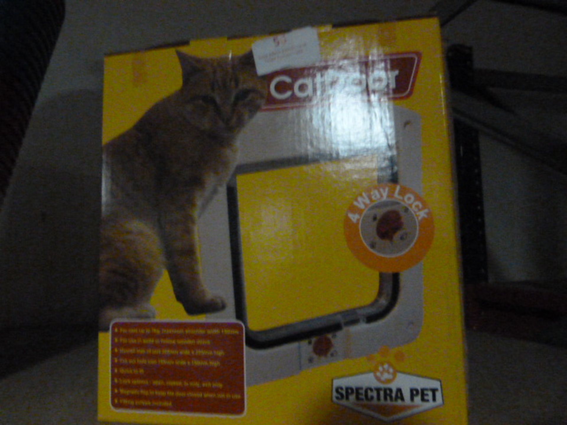 Box Containing Twelve Spectra Pet Doors