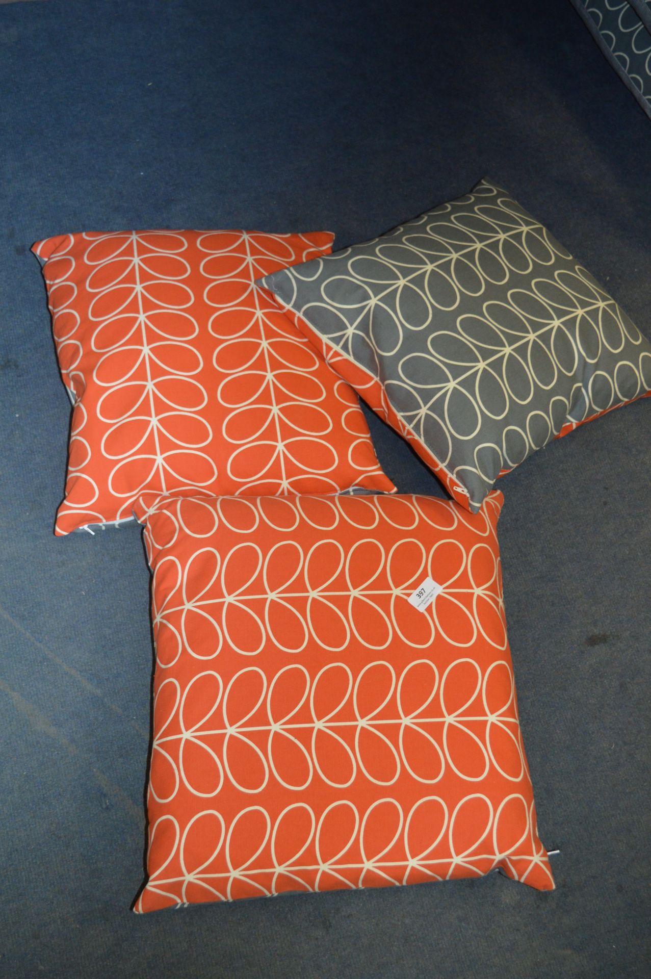 Set of Three Orange and & Grey Patterned Cushions