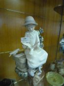Nao Figurine - Young Lady Sat on a Stone Bench wi