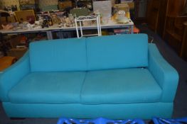Blue Upholstered Sofa Bed with Drop Arm