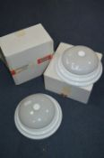 Two White Circular Ceiling Lamps