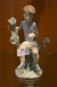 Nao Figurine - Boy with Bird in Hand