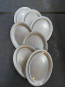 Ten Oval Plastic Trays