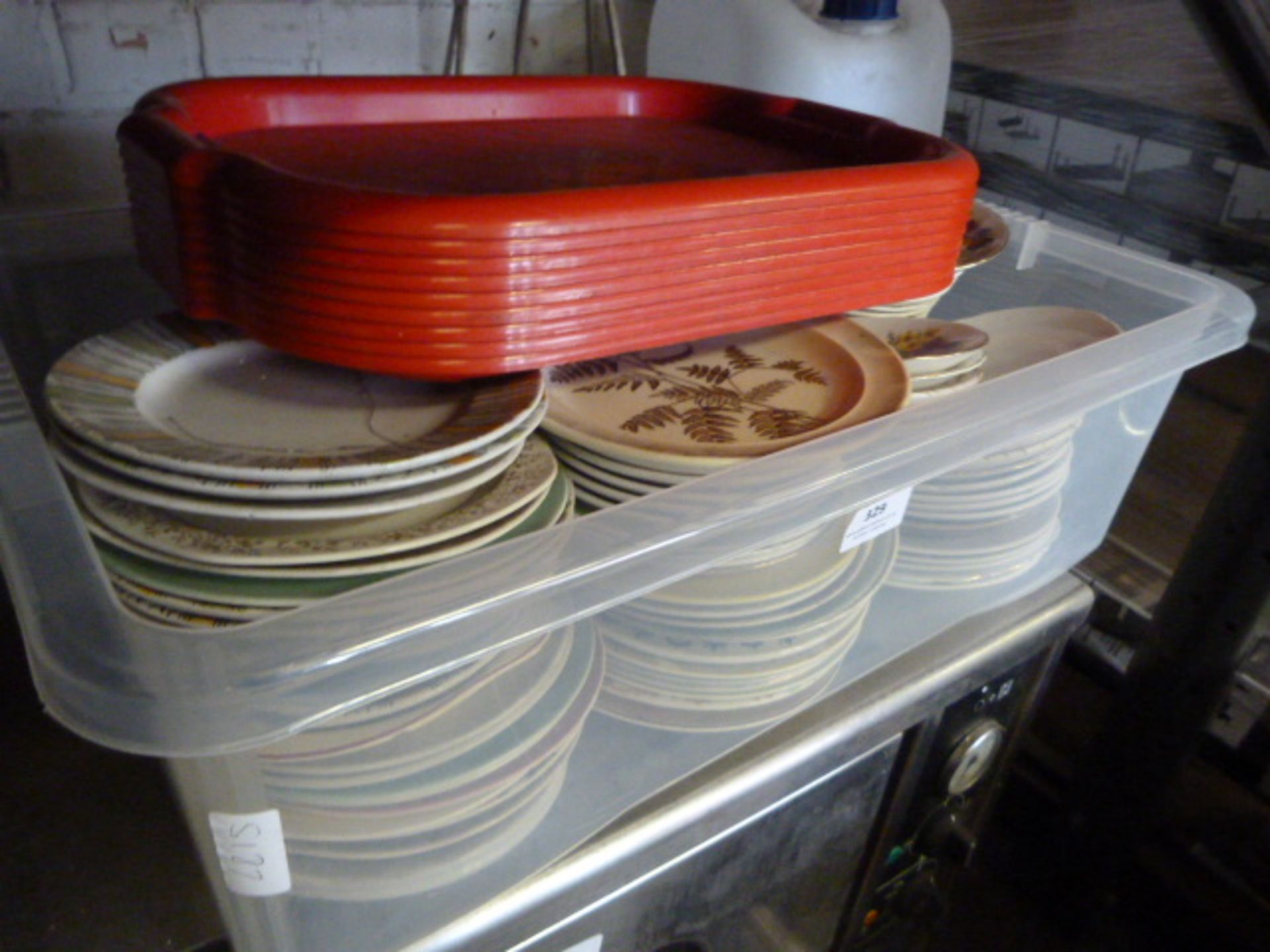 Box Containing Saucers, Side Plates and Nine Red T