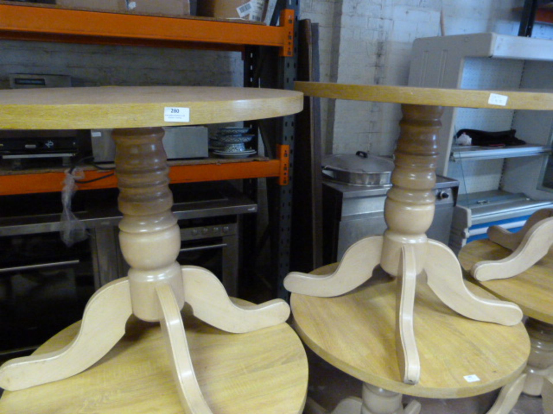 Two Circular Oak Cafe Tables on Pedestal Bases