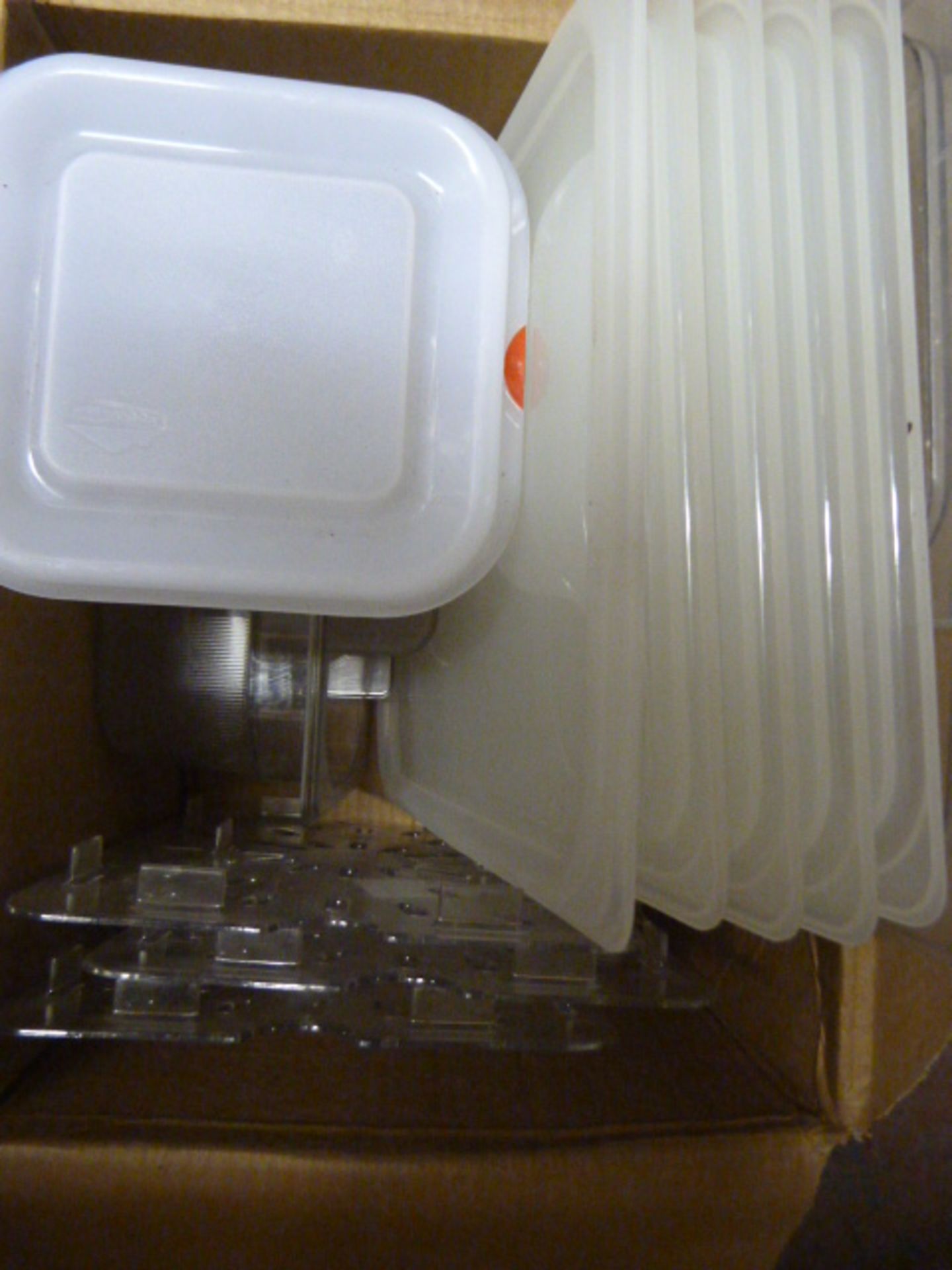 *Box Containing Clear Plastic Container Lids