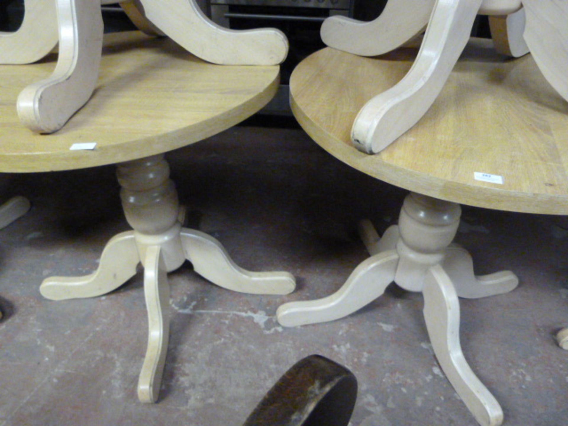 Two Circular Oak Cafe Tables on Pedestal Bases