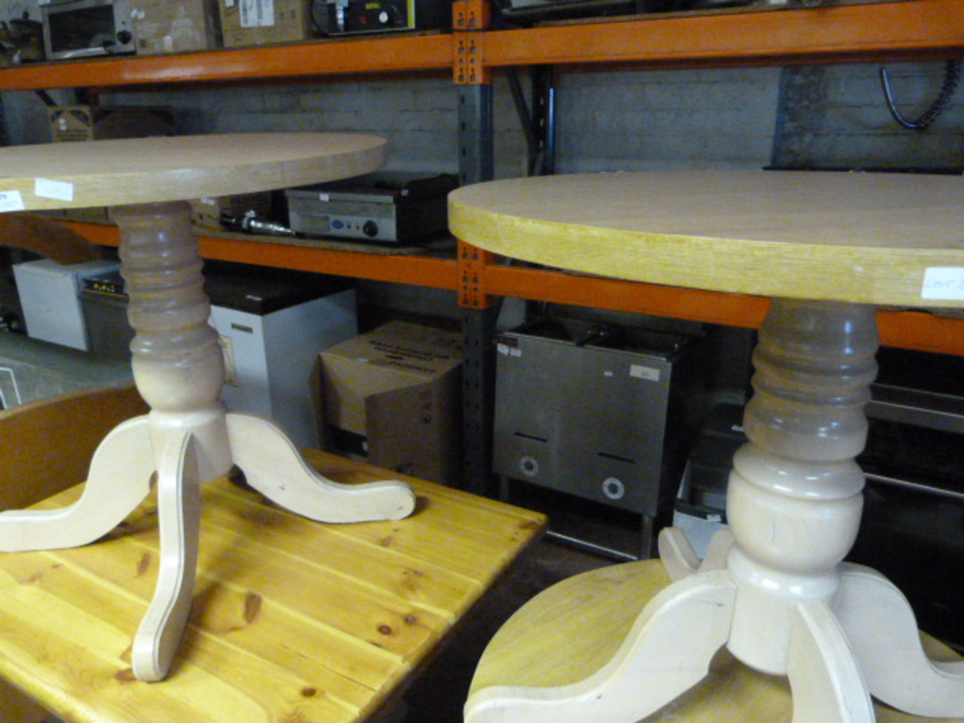 Two Circular Oak Cafe Tables on Pedestal Bases