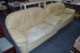Two Cream Leather Two Seat Sofas