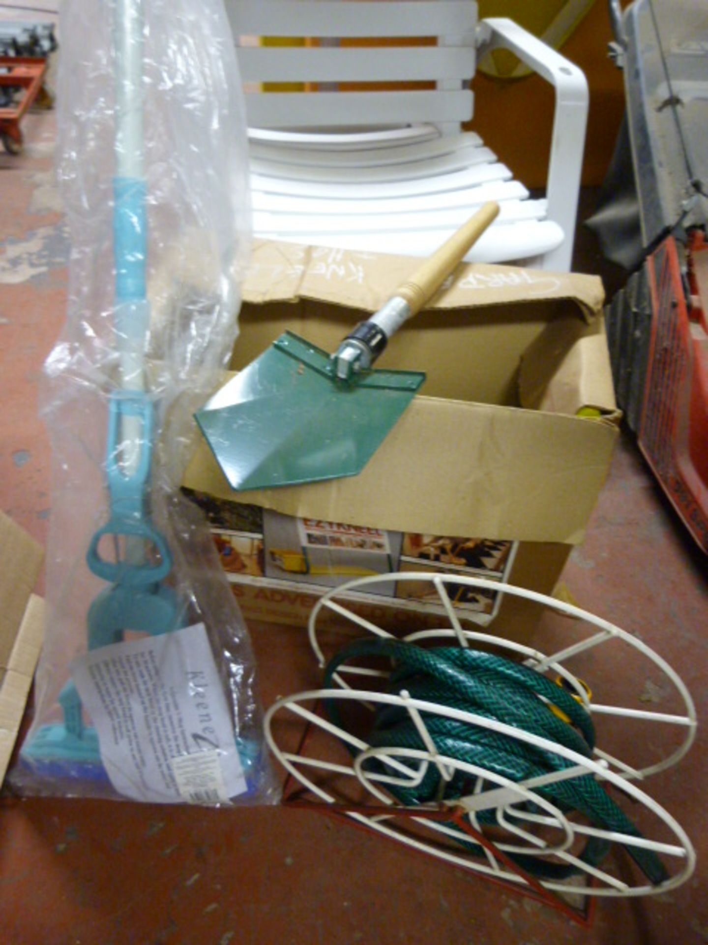 Box Containing Hosepipe, Small Spade and a Mop