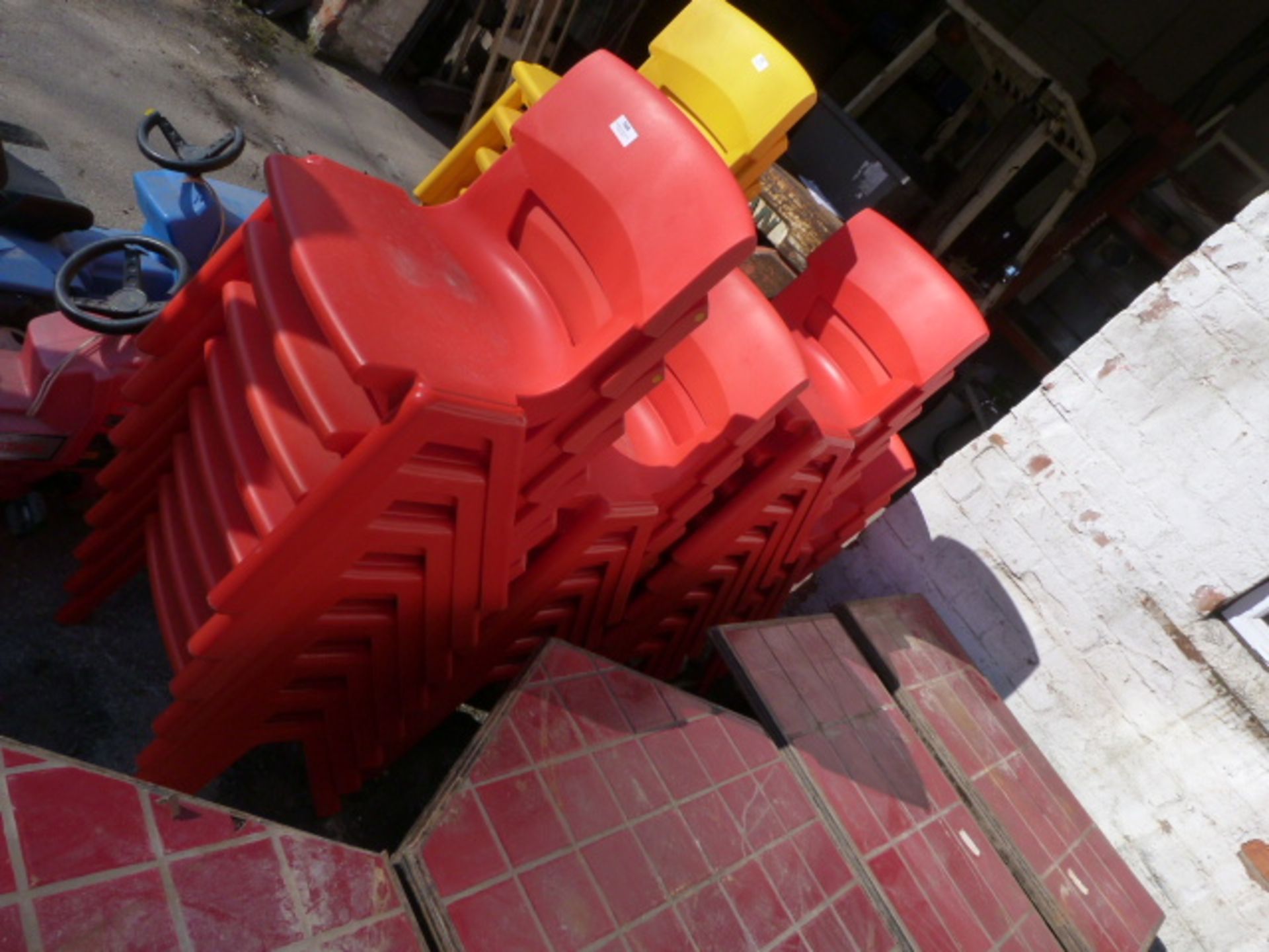 Twenty Six Red Plastic Chairs