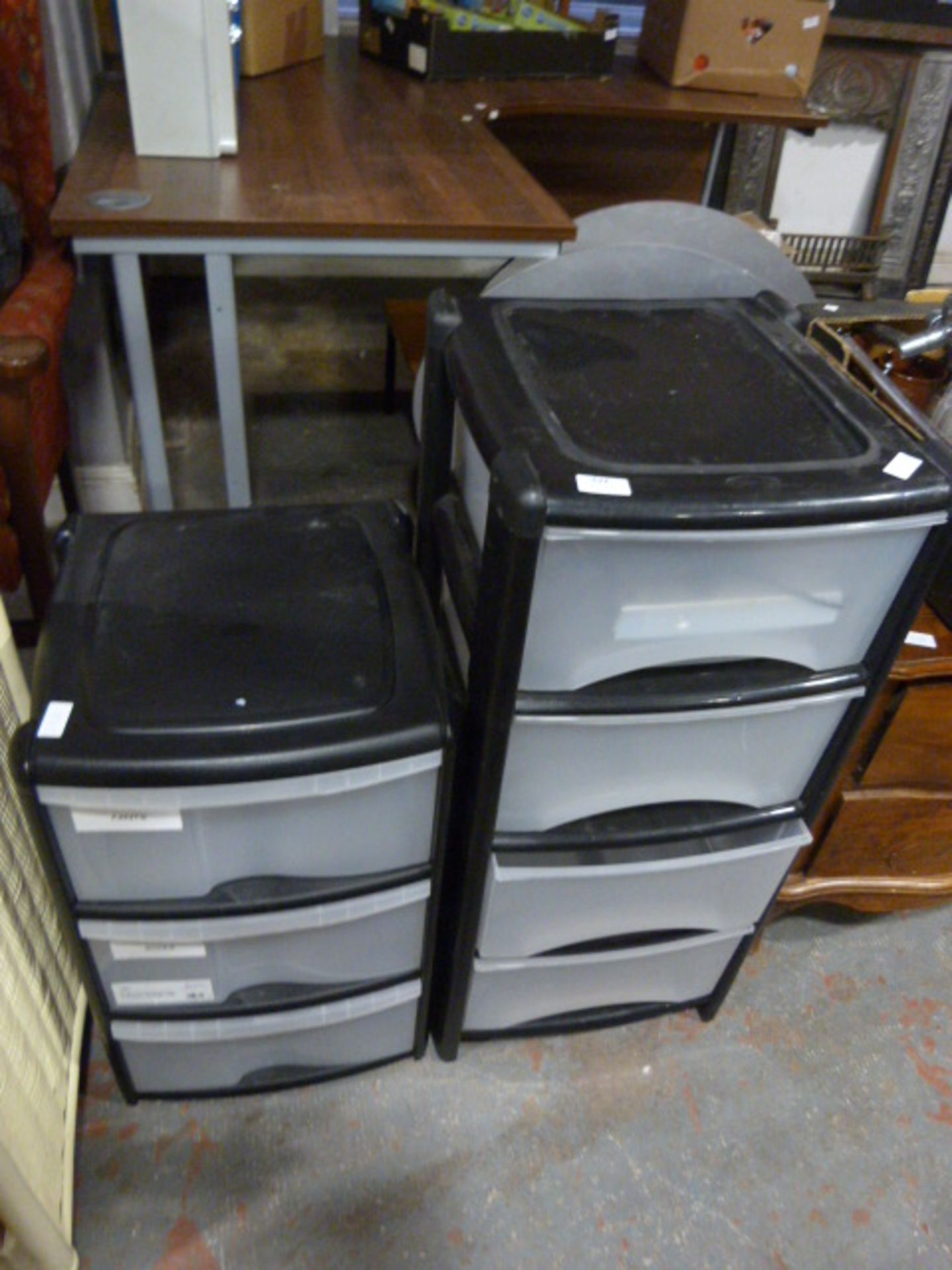 Set of Three and a Set of Four Plastic Drawers