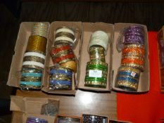 Four Boxes of Assorted Asian and Costume Bangles