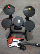 Toy Guitar and an Electric Drum Kits