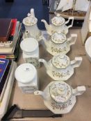 Floral Patterned Teapots and Storage Jars