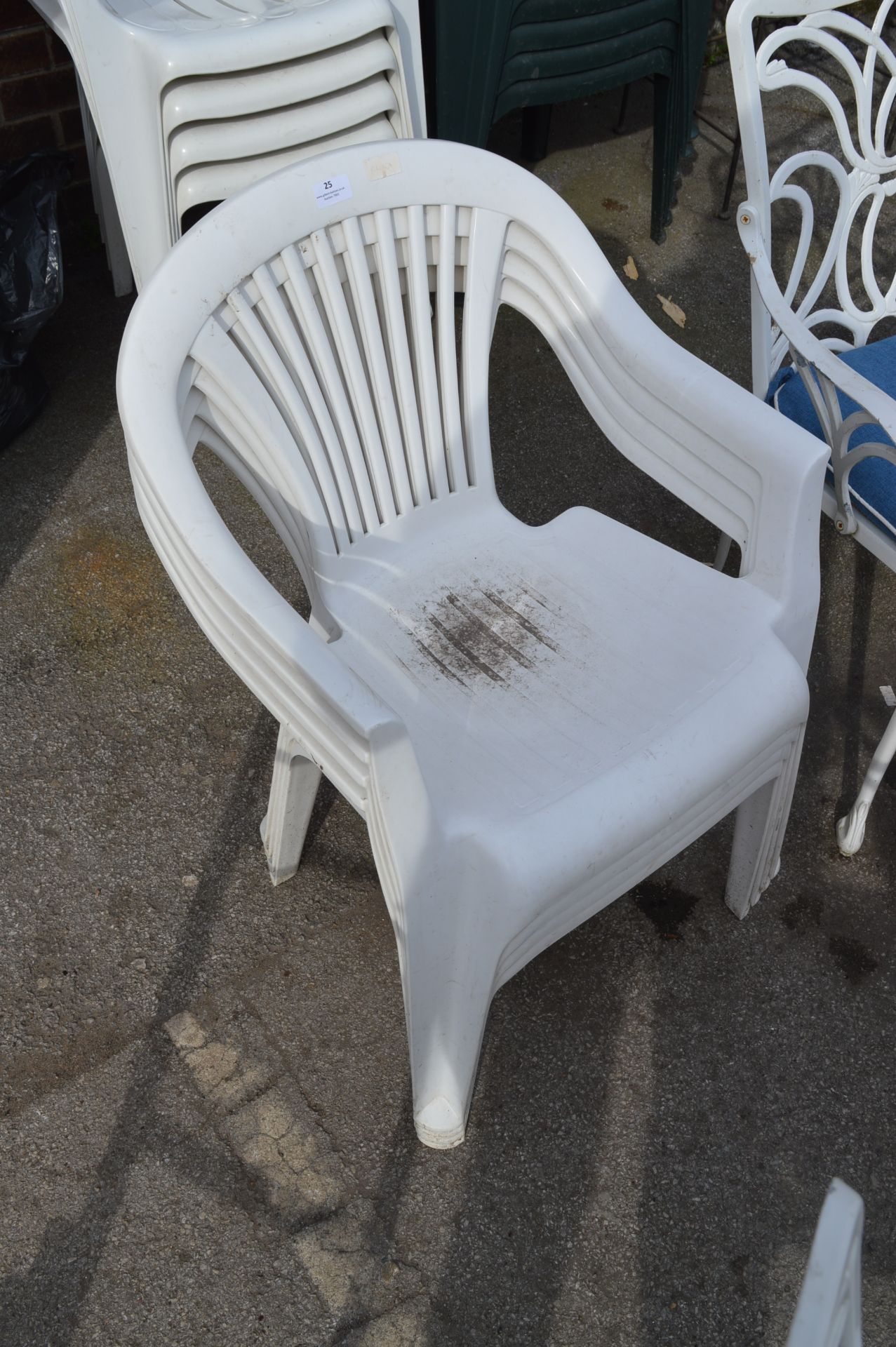 Four White Plastic Garden Chairs