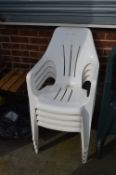 Four White Plastic Garden Chairs