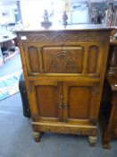 Oak Drinks Cabinet with Carved Panel Doors