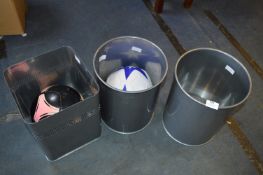 Three Stainless Steel Wastebins and Two Footballs