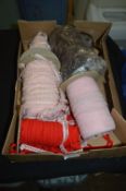 Three Rolls of Pink, a Roll of Brown and a Roll of Red Elasticated Lingerie Trim