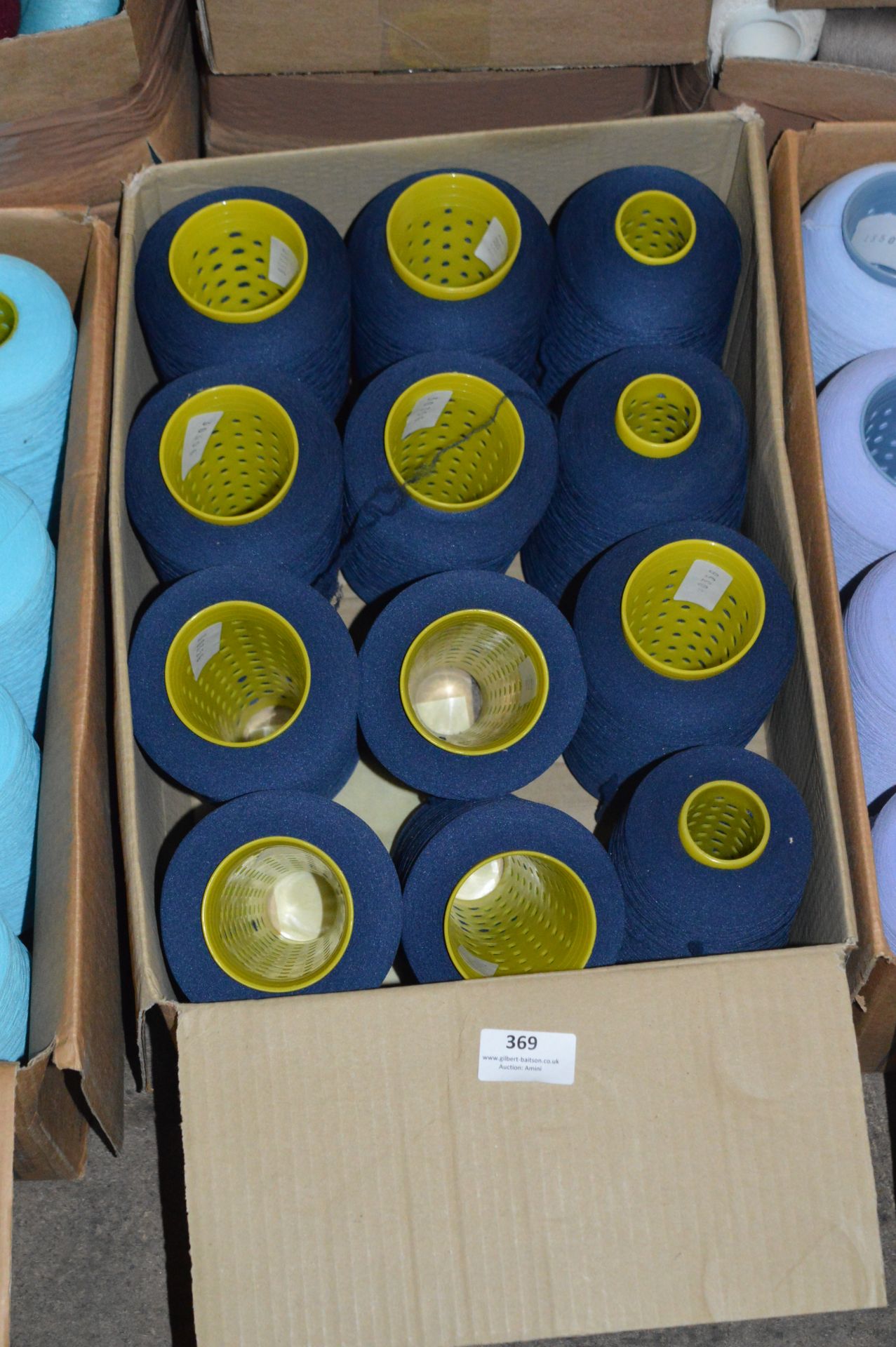 Twelve Cones of Navy Blue Polyester Thread