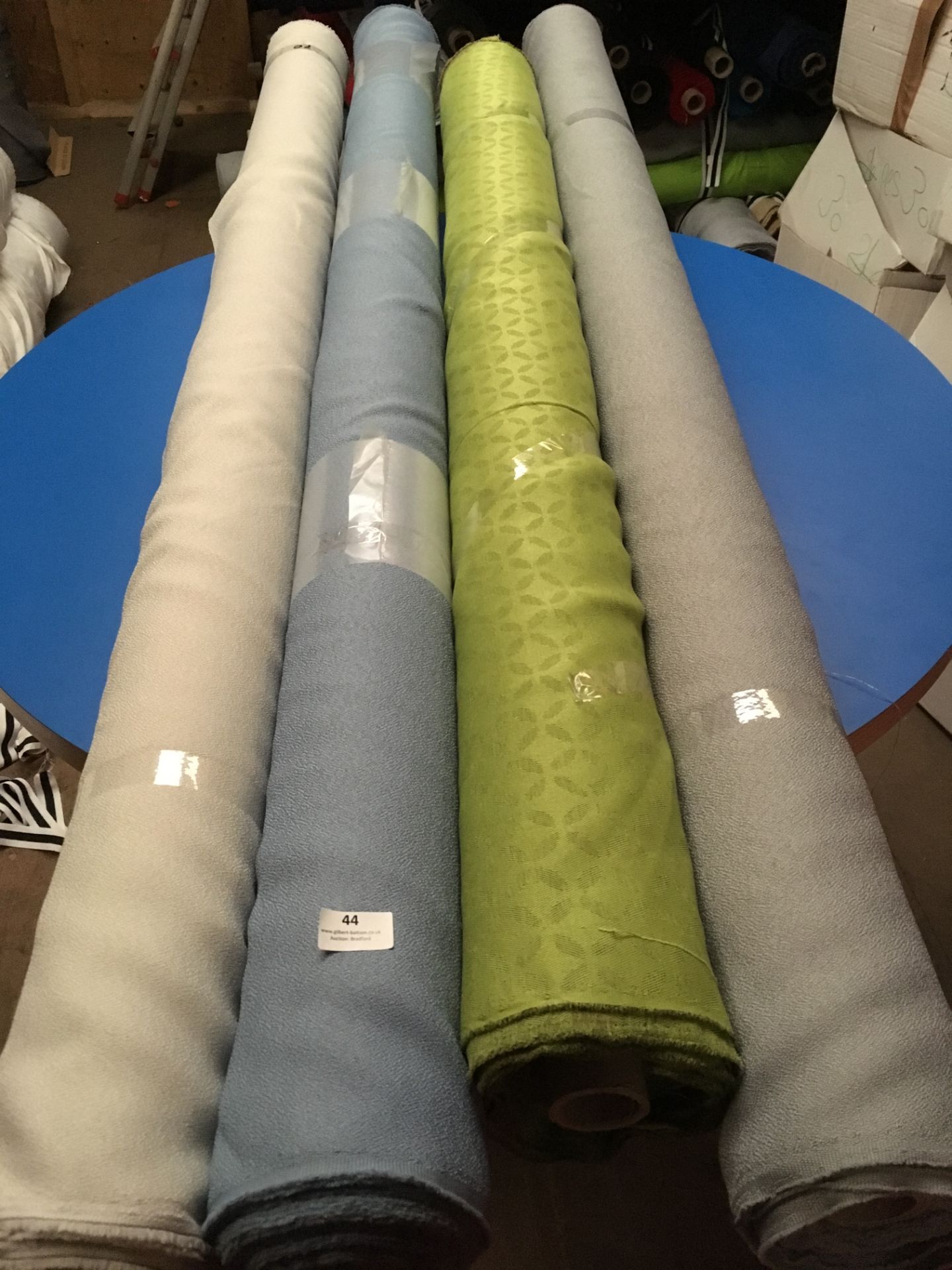 Four Rolls of Polyester Crepe Fabric Assorted Colours and Lengths