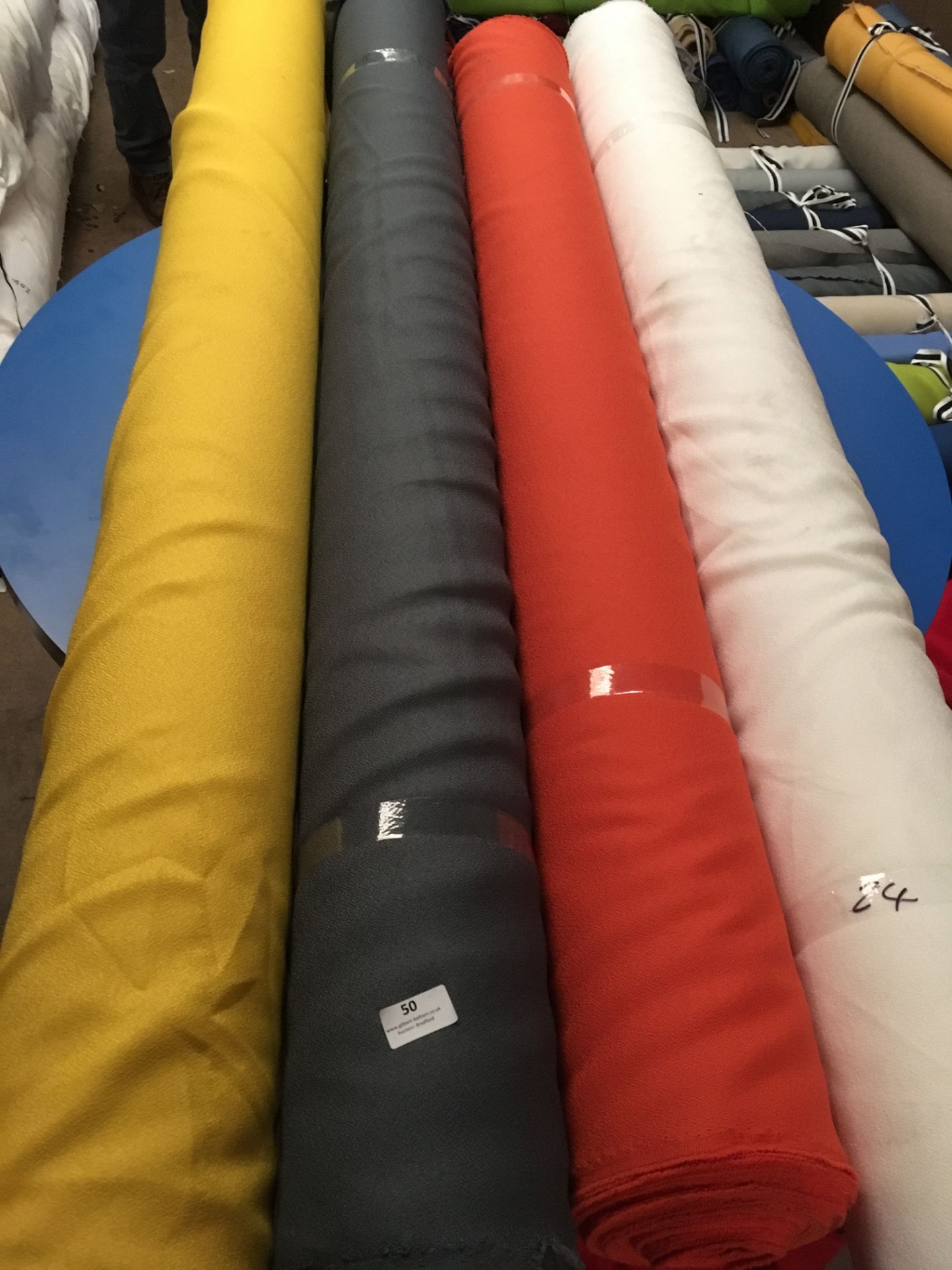 Four Rolls of Polyester Crepe Fabric Assorted Colours and Lengths