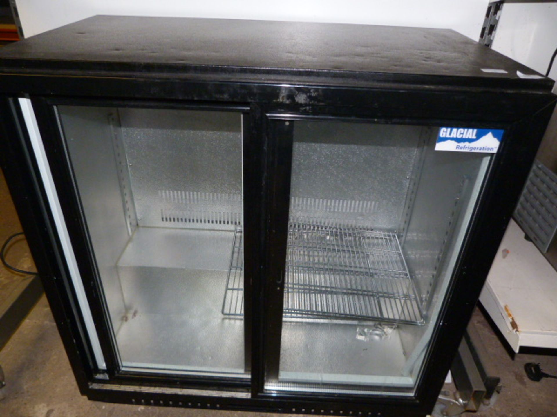 Undercounter Bottle Cooler Enclosed by Sliding Double Doors