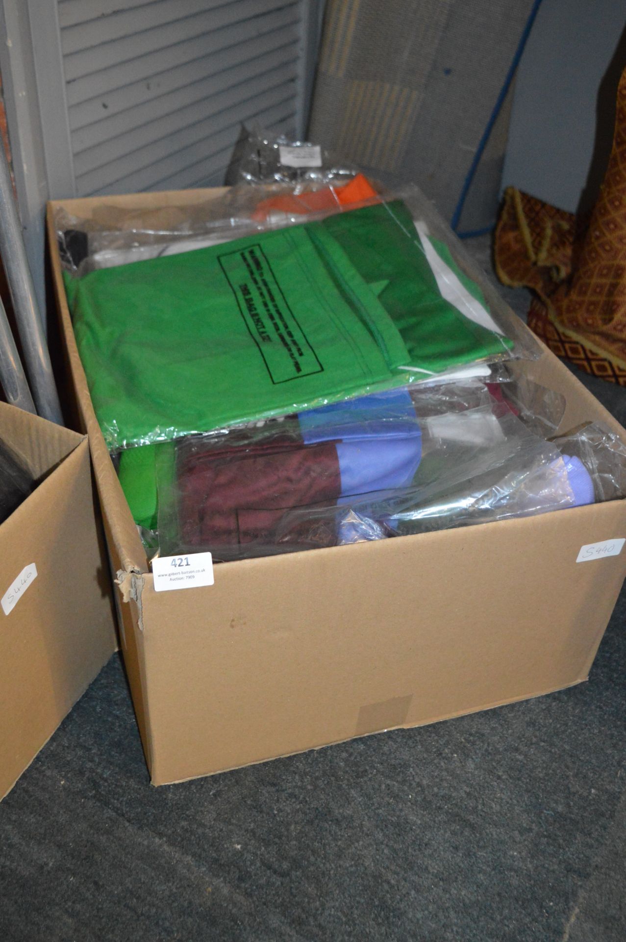 Box Containing a Quantity of Sports Tops